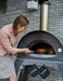 Women cooking with ALFA FORNI Ciao Pizza Oven.